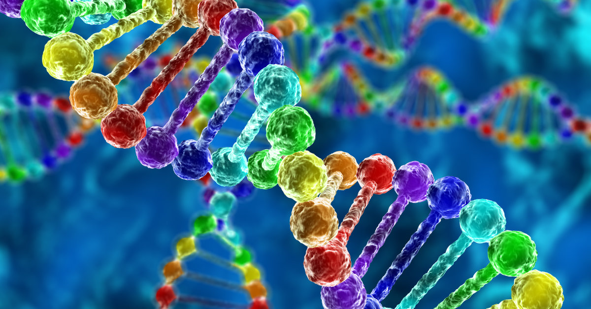 Una catena di DNA color arcobaleno su fondo blu che si snoda sotto la scritta aniridia's roots (le radici dell'aniridia)